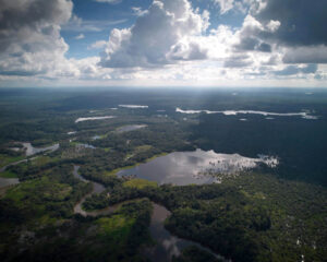 Sensitive ecosystem: Just a few liters of oil can contaminate entire river courses in the Amazon region. The photo shows the lagoon landscape of Lagarto Cocha in Ecuador. The ancestral territory of the Siekopai community consists of blackwater lagoons and partially flooded forests. Today it is surrounded by oil fields and palm oil plantations. Photo: Nico Kingman, with cortesy of @AlianzaCeibo (6) On patrol: Communities like the A'i Kofan now monitor their ancestral territory in the Amazon with traditional spears and GPS devices to document illegal activities and exploration. Photo: Nico Kingman